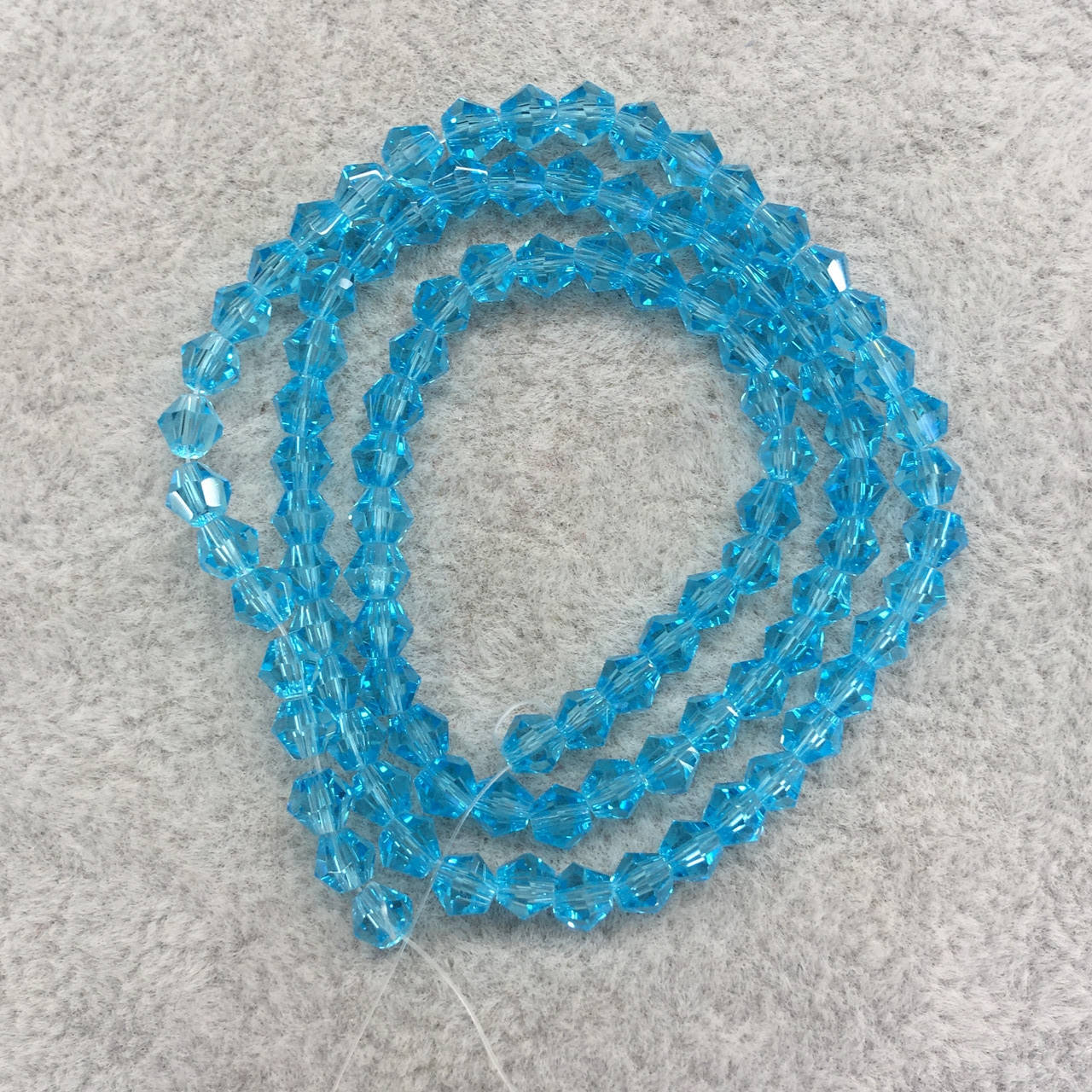 

Биконус 4 мм голубой