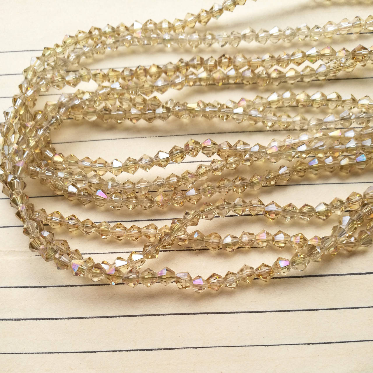 

Кришталева намистина, біконус, шампань з перламутровим напиленням, 4 мм, 120 шт/упаковка