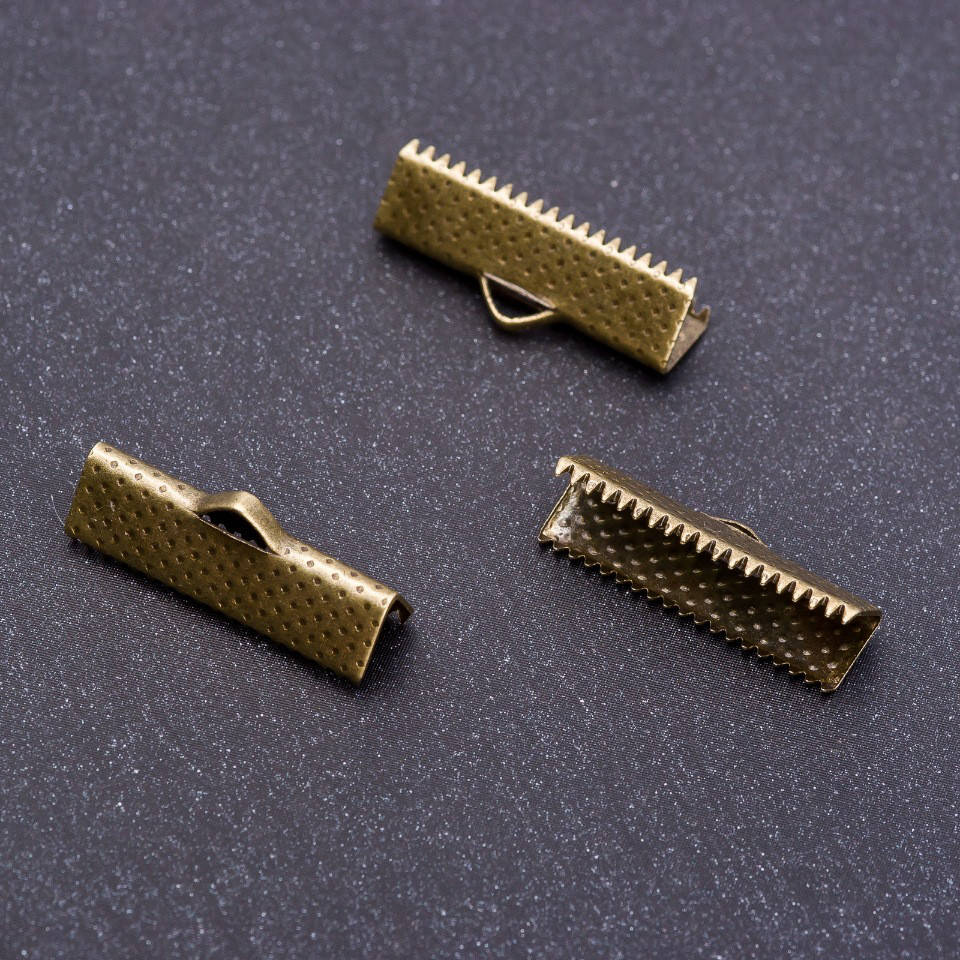 

Фурнитура фиксатор "бронза" d20х6мм фас.34шт