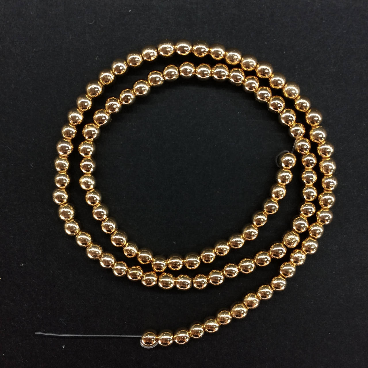 

Бусины на нитке Гематит d=4мм цвет золото