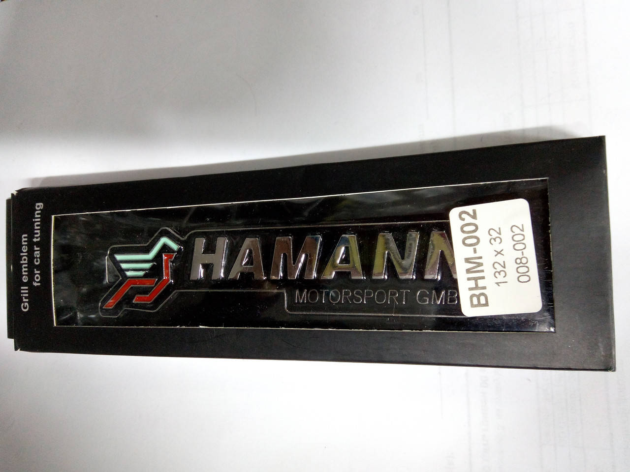 

Надпись HAMANN в решетку радиатора металл 132х32 мм
