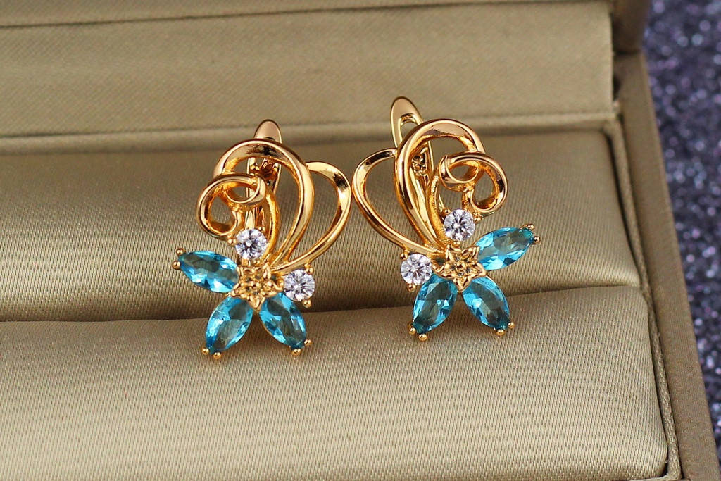 

Серьги Xuping Jewelry вихрь с голубыми камнями 1,8 см камнями золотистые