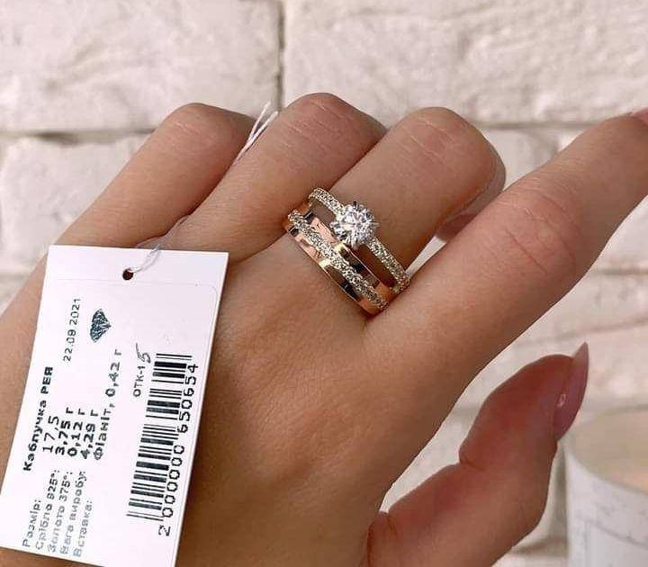 

Двойное кольцо из серебра, золота и украшенное фианитами Рея