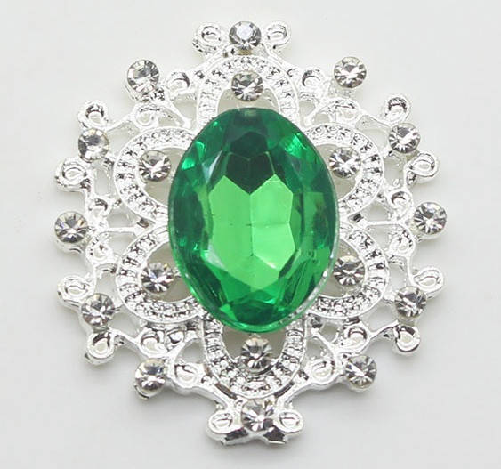 

Камень в серебристой ажурной оправе 24*26 мм зеленый