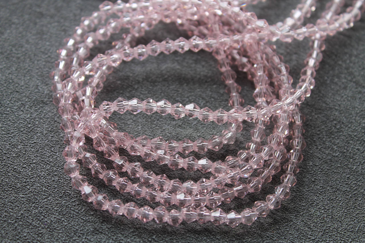 

Биконус, 4\4 мм, нить (100 +- шт), цвет - розовый прозрачные