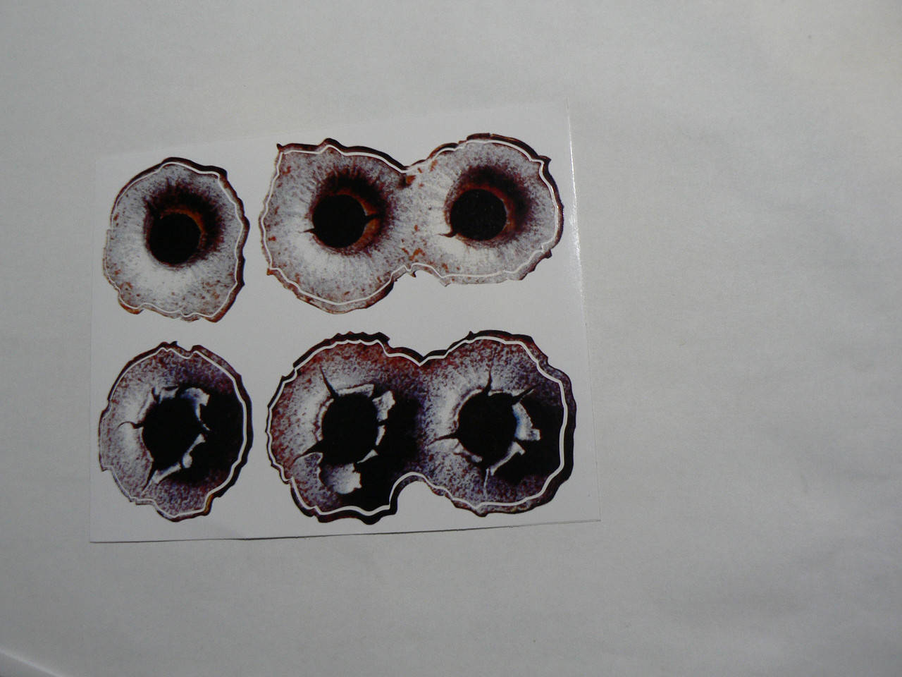 

Наклейка пп Пули 123х95мм на авто отверстия следы дыры дырки от пуль виниловая