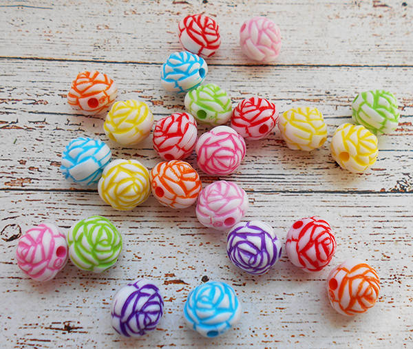 

Пластикова бусинка-квіточка 11мм., з отвором. Колір на вибір продавця. (М-582)