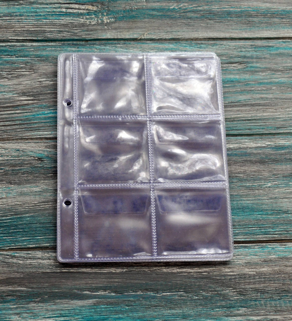 

Лист для монет 125х165 до альбому Marcia / SCHULZ MINI - (2*3) на 6 монет (55х55мм) тип 6