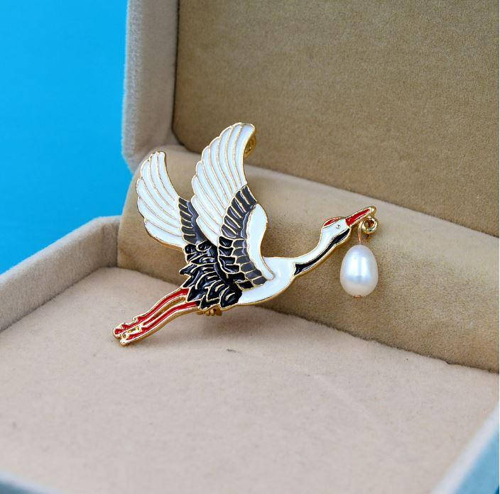 

Медицинская брошь "Аист в полете "