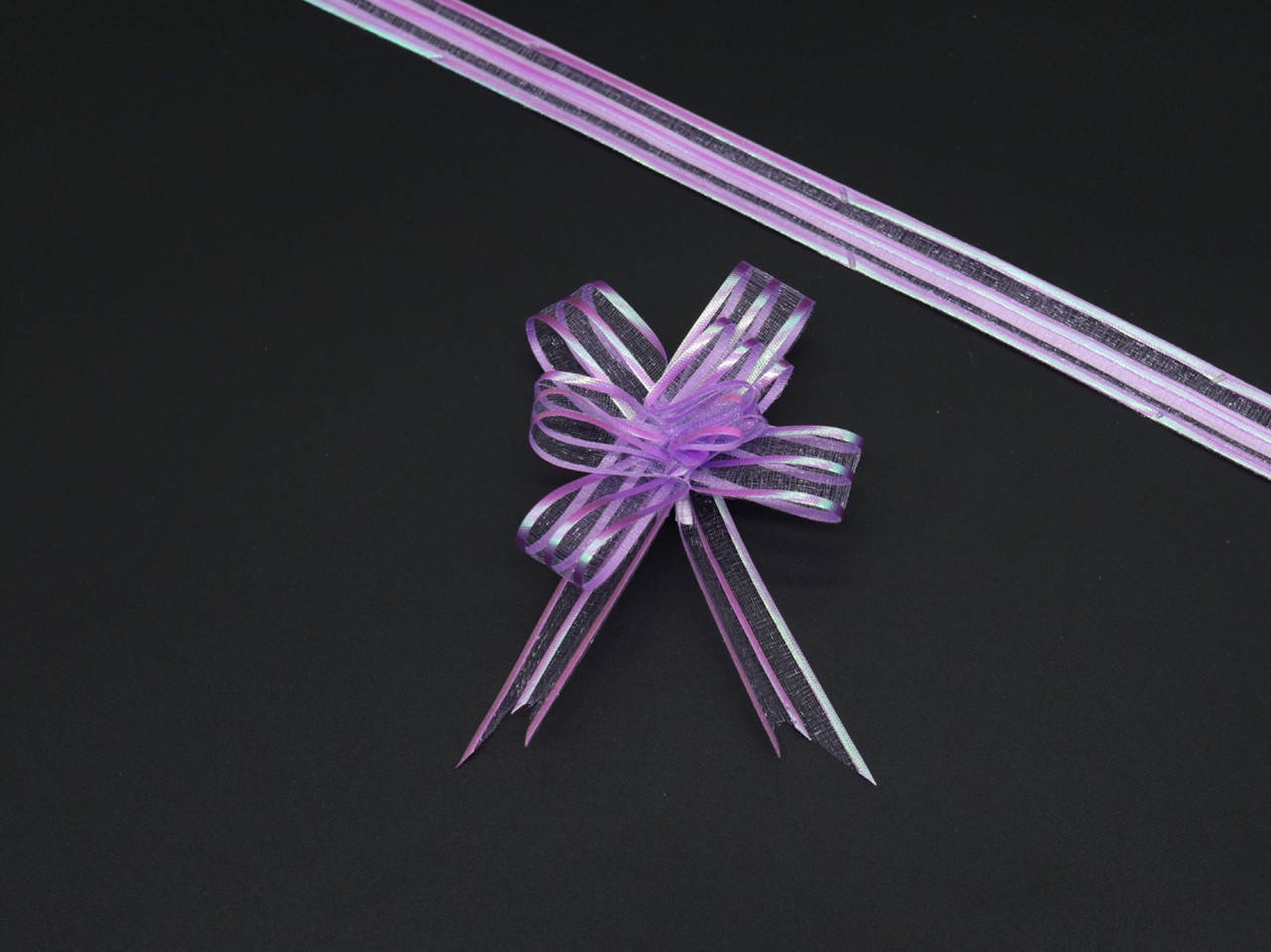 

Подарочные банты на затяжках. Цвет "сирень". 3х7см