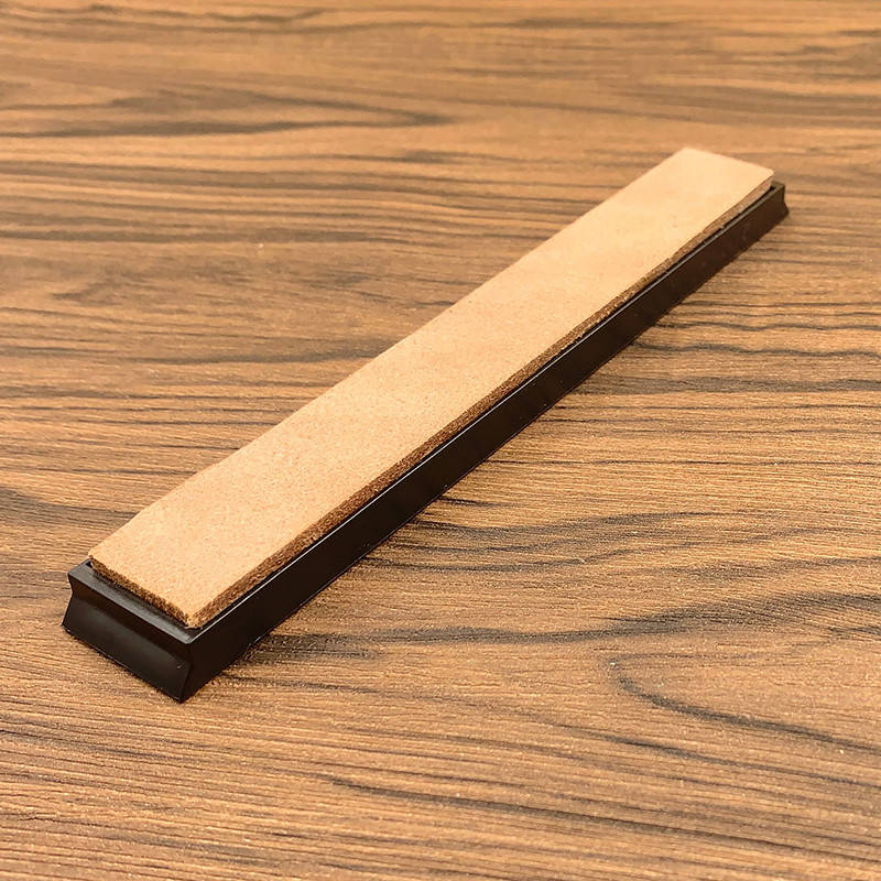 

Брусок с кожаным полотном для правки ножей.