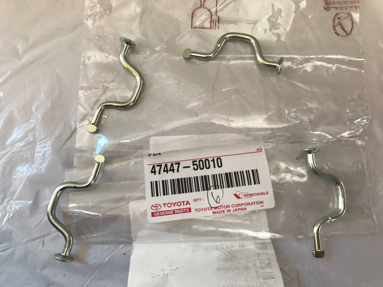 

Штифт колодок стояночного тормоза, изогнутый 47447-50010. TOYOTA