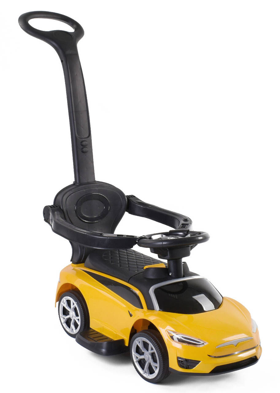 

Каталка толокар машинка спорткар Тесла с родительской ручкой JOY и защитным бампером музыка от 1 года желтый