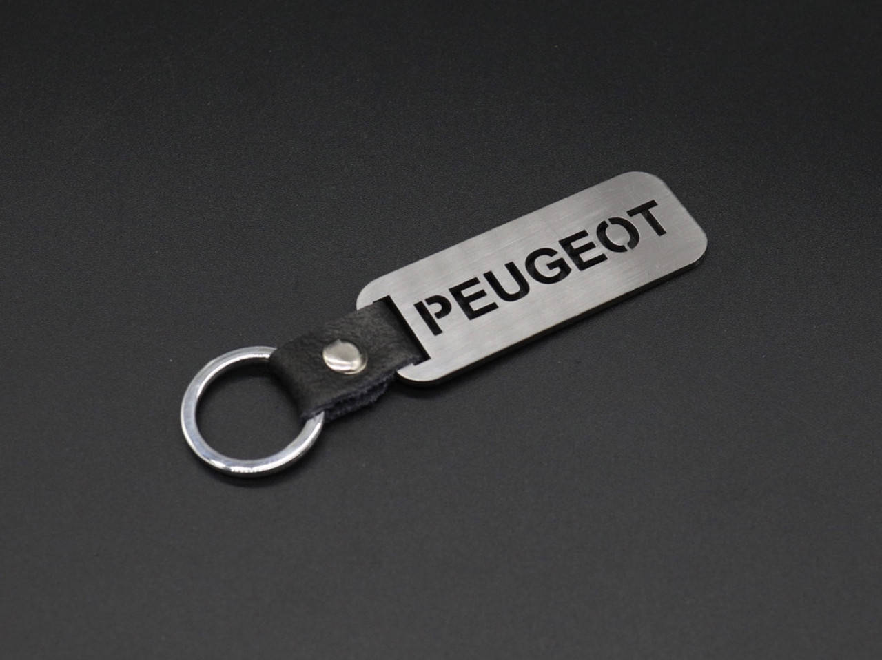 

Брелок металлический. Peugeot. 10х2,5см, Коричневый