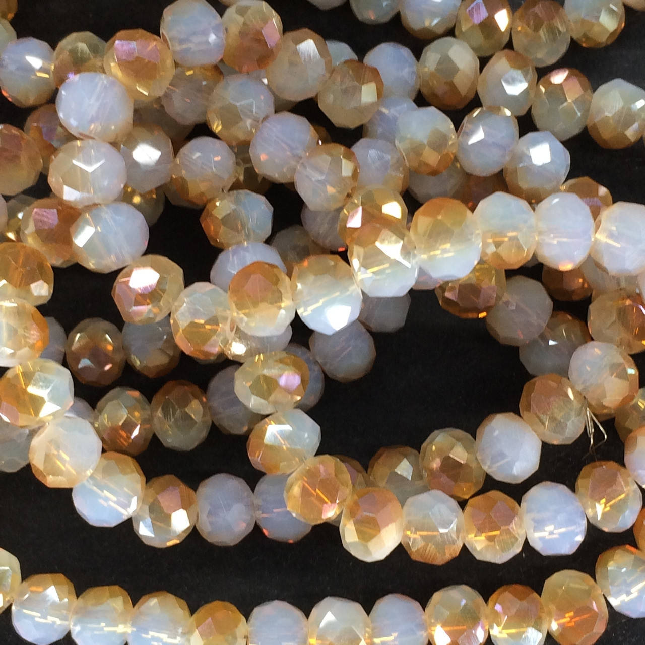 

Бусины на нитке Стекло рондель d=6мм шампанское (~100 бусин на на нитке)