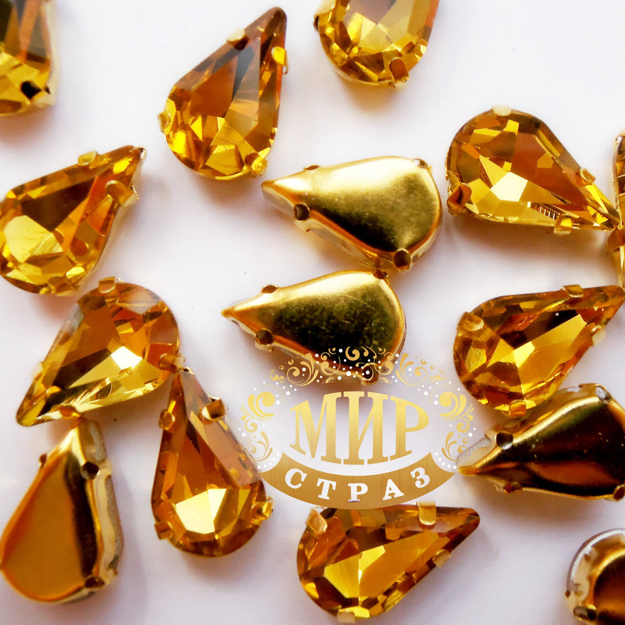 

Стразы в золотых цапах Topaz, Размер 8x13мм*1шт