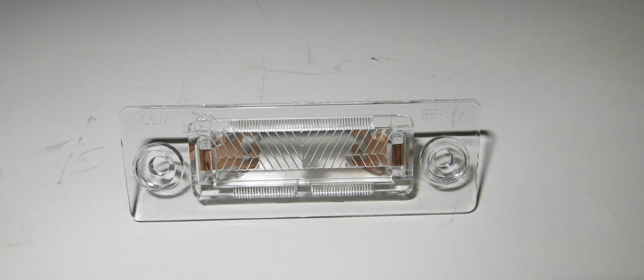 

Фонарь подсветки номера VW CAddy 3 VW Transporter T5