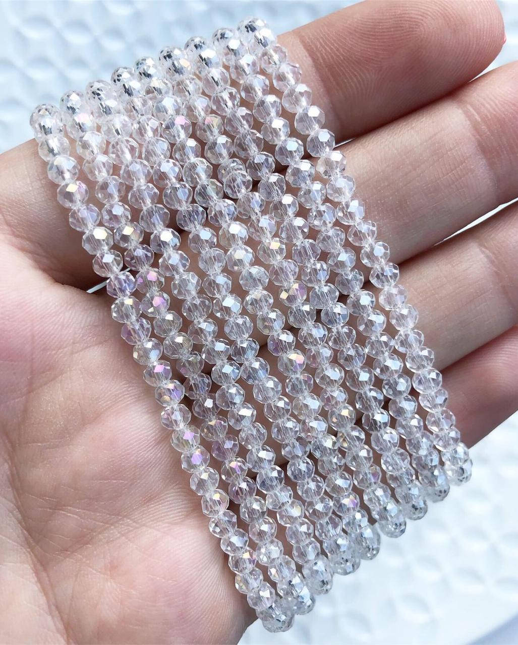 

Бусины хрустальные (Рондель) 6х4 мм пачка 90-95 шт, цвет - прозрачный хрусталь с переливом