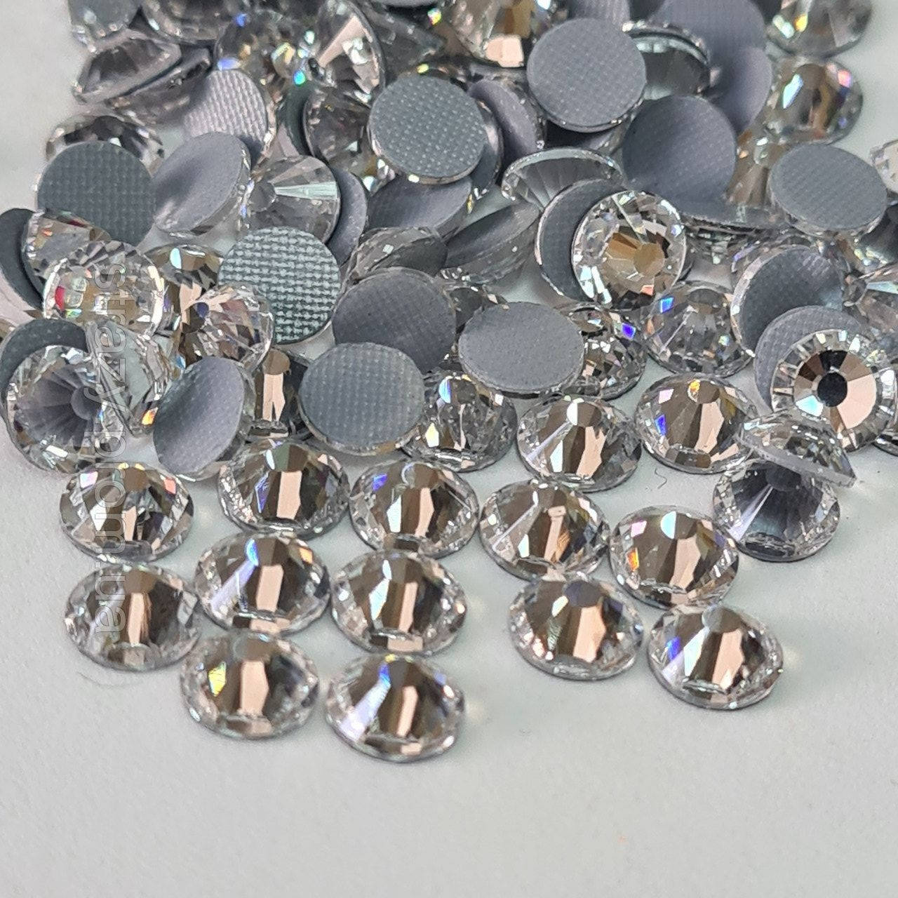 

Термо стразы Премиум ss12 Crystal +++ (3.0mm) 1400шт (вафельный клей)