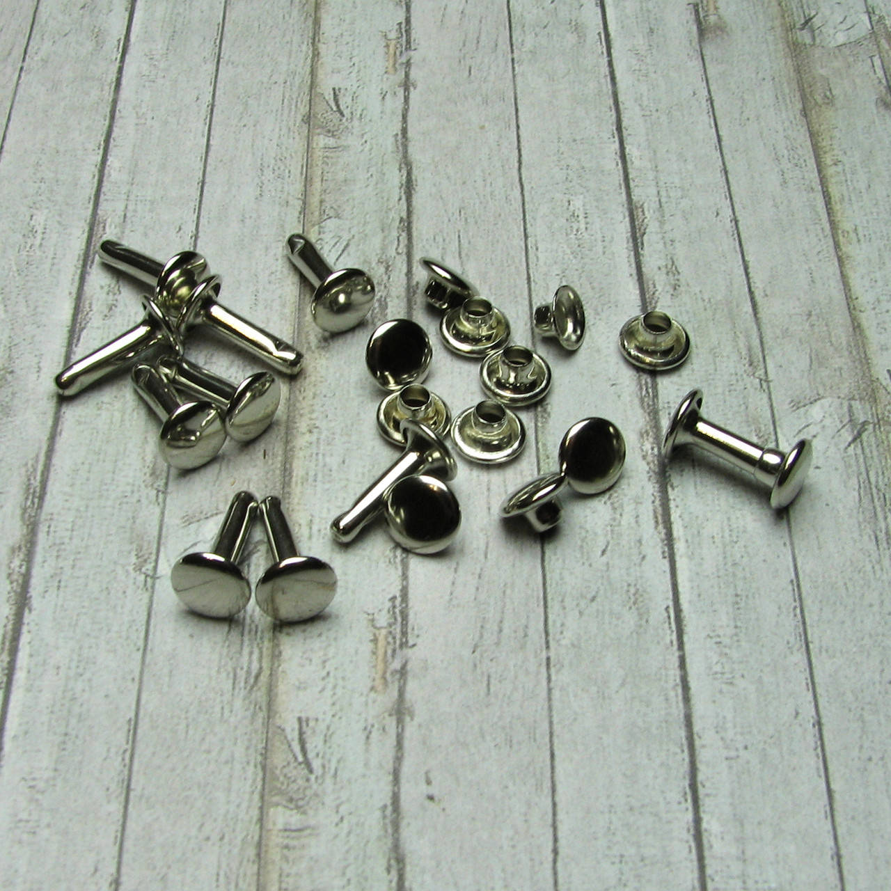 

Хольнитены двусторонние для кожи Заклепки 8*9мм 10шт (FHL017), Серебро