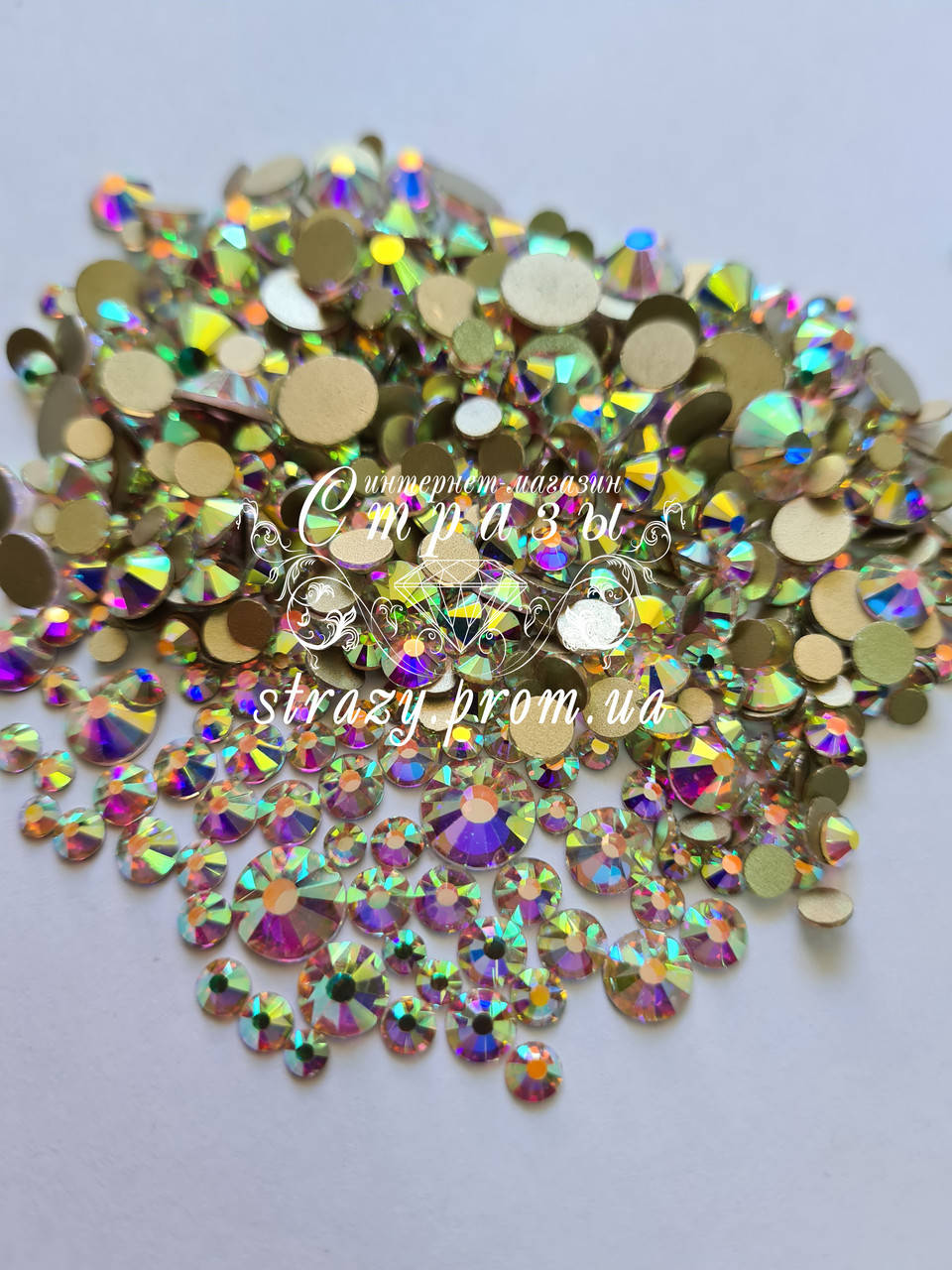 

Стразы Микс размеров ss12-ss50 Crystal AB 1440шт "Crystal Premium" золотая подложка