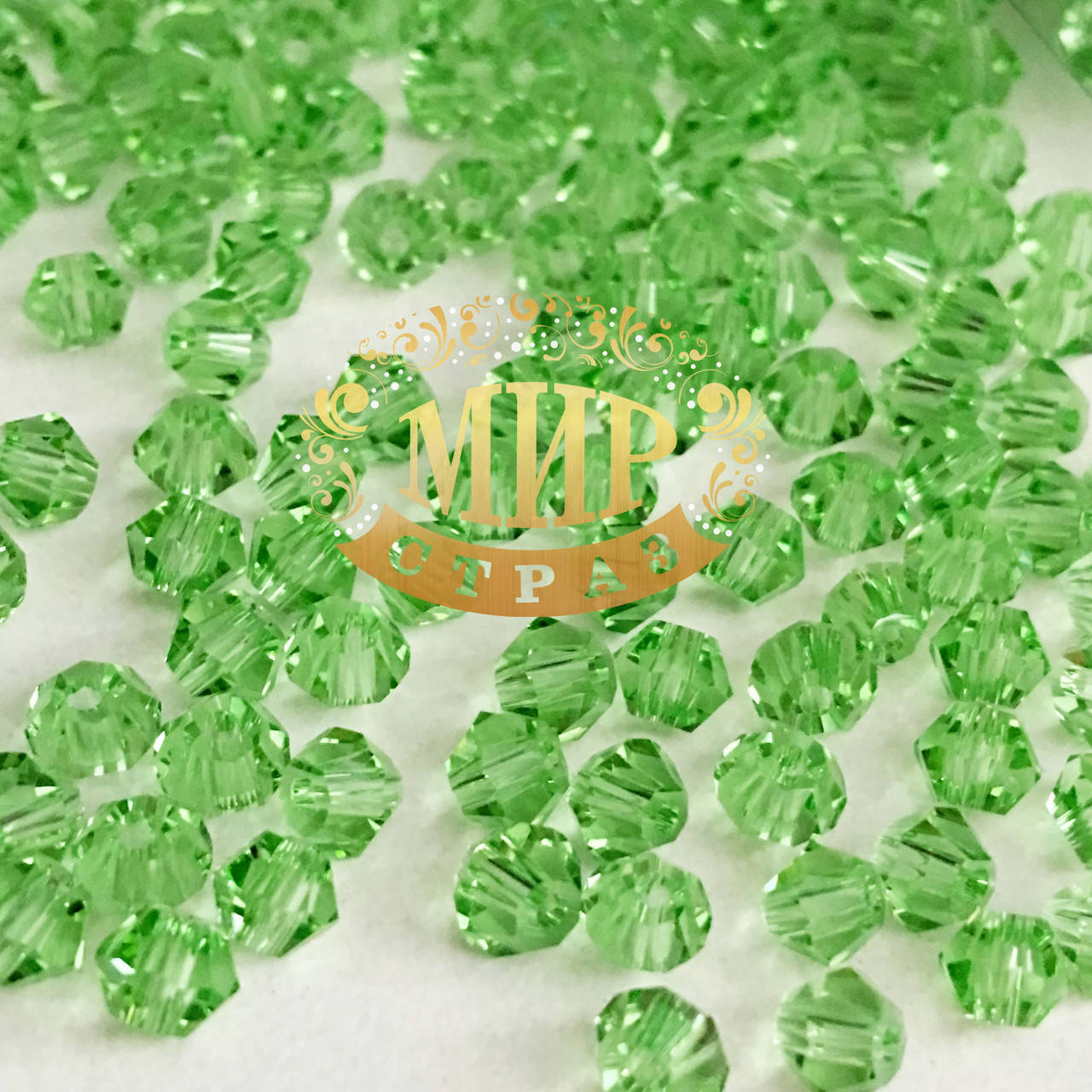 

Бусины премиум класса Биконусы Peridot 4mm (1шт)
