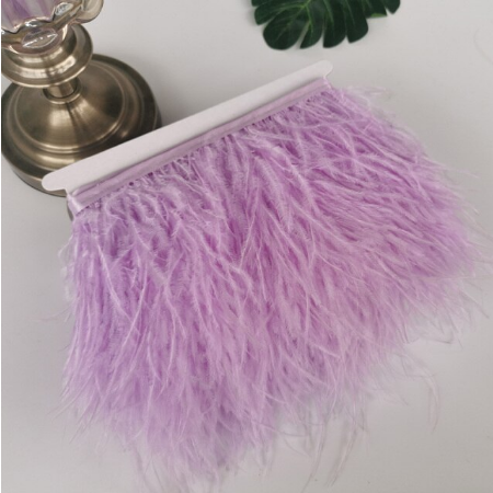 

Перьевая тесьма страусиная. Цвет Сиреневый. Перо 10-15см.Цена за 0,5м.