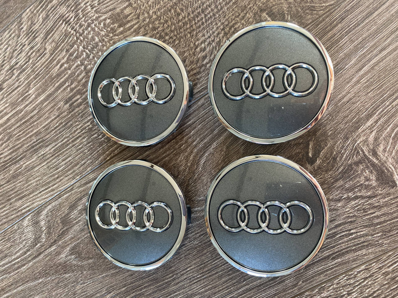 

Колпачки на диски Audi 4M0601170 61/58mm черные(серые)