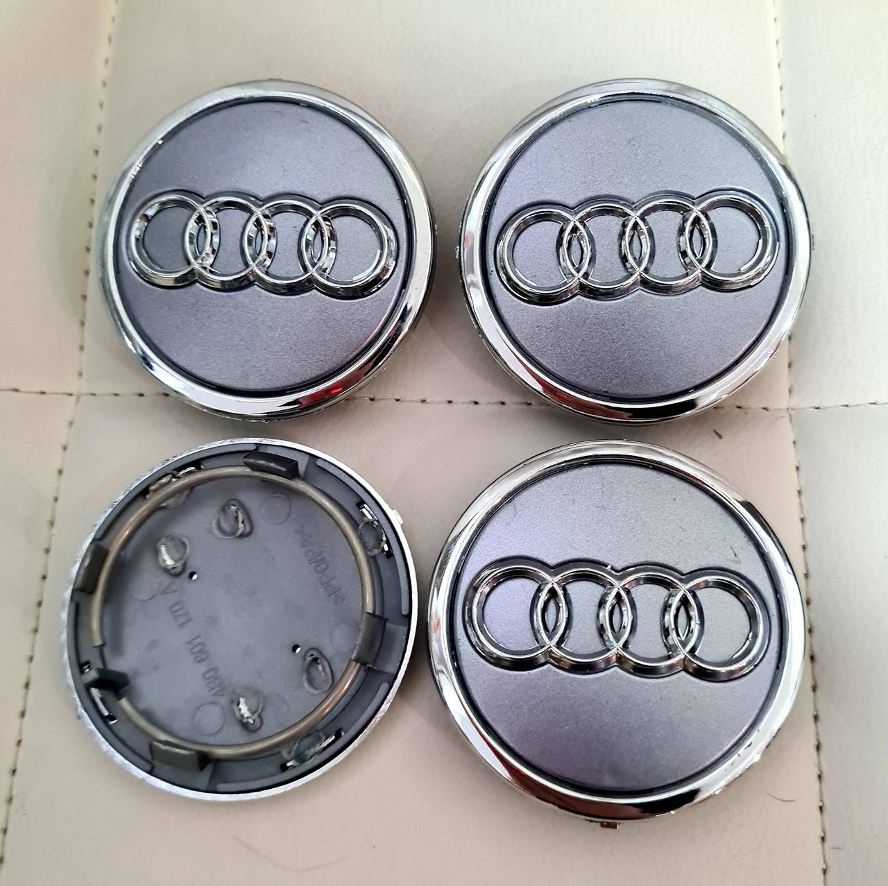 

Колпачки, заглушки на диски Audi Ауди 69 мм / 57 мм серые с кольцом