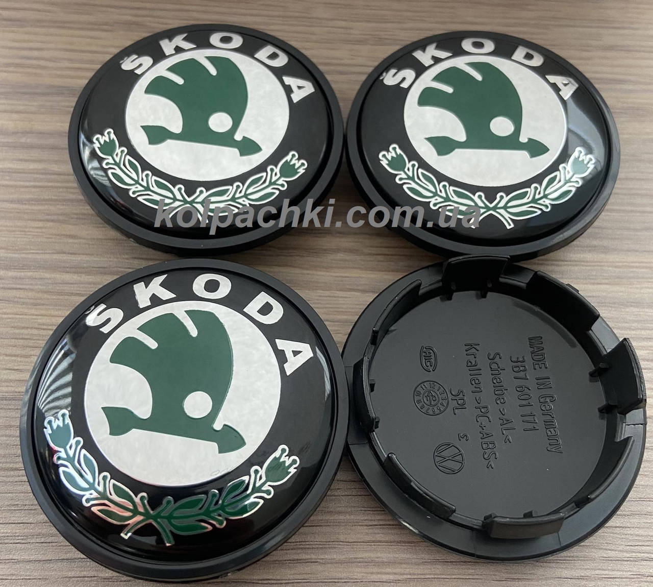 

Колпачки Skoda Шкода 65/56 мм черные с зеленым логотипом 65мм 56мм 3B7601171