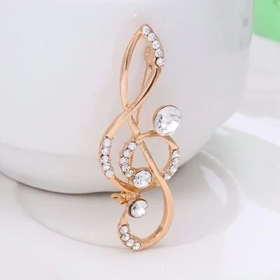 

Брошь скрипичный ключ