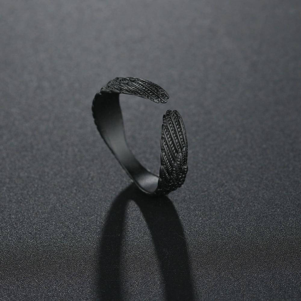 

Чорна каблука з крилами розмір реголюється