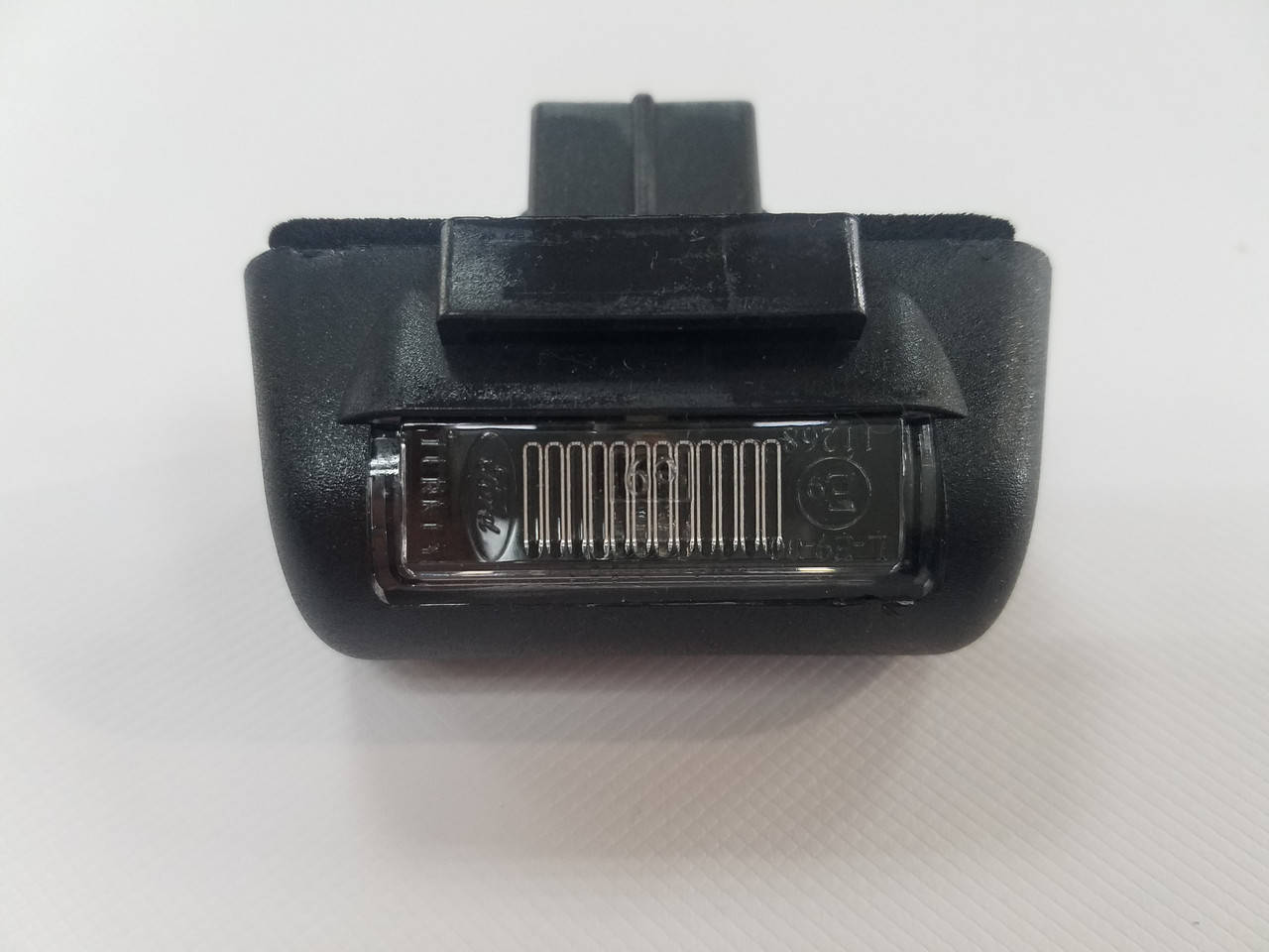 

Фонарь подсветка задний номера 86-00 FORD 1732840