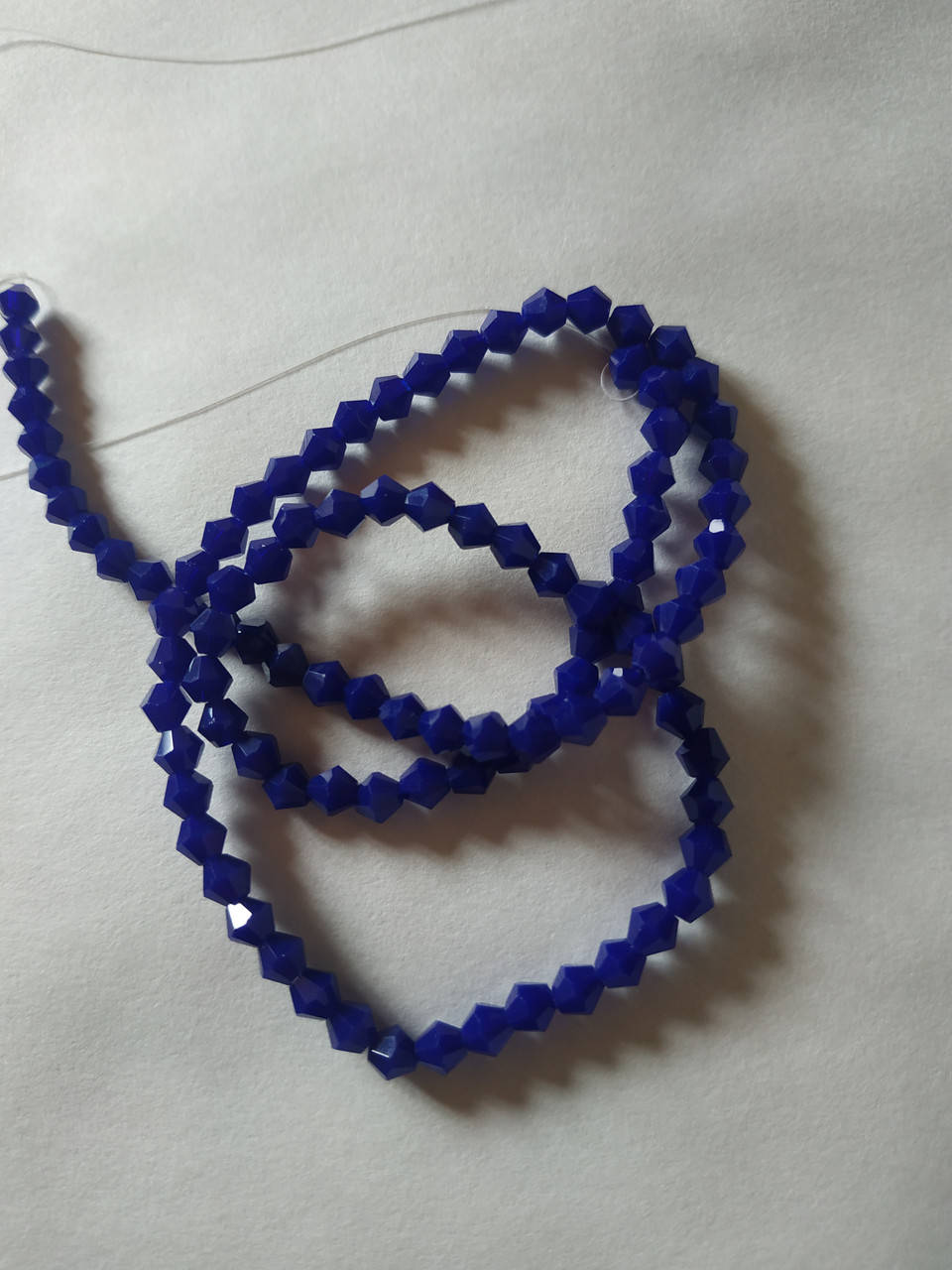 

Биконус (хрусталь) - 4 мм. В упаковке прим- 100 шт. Цвет - синий матовый