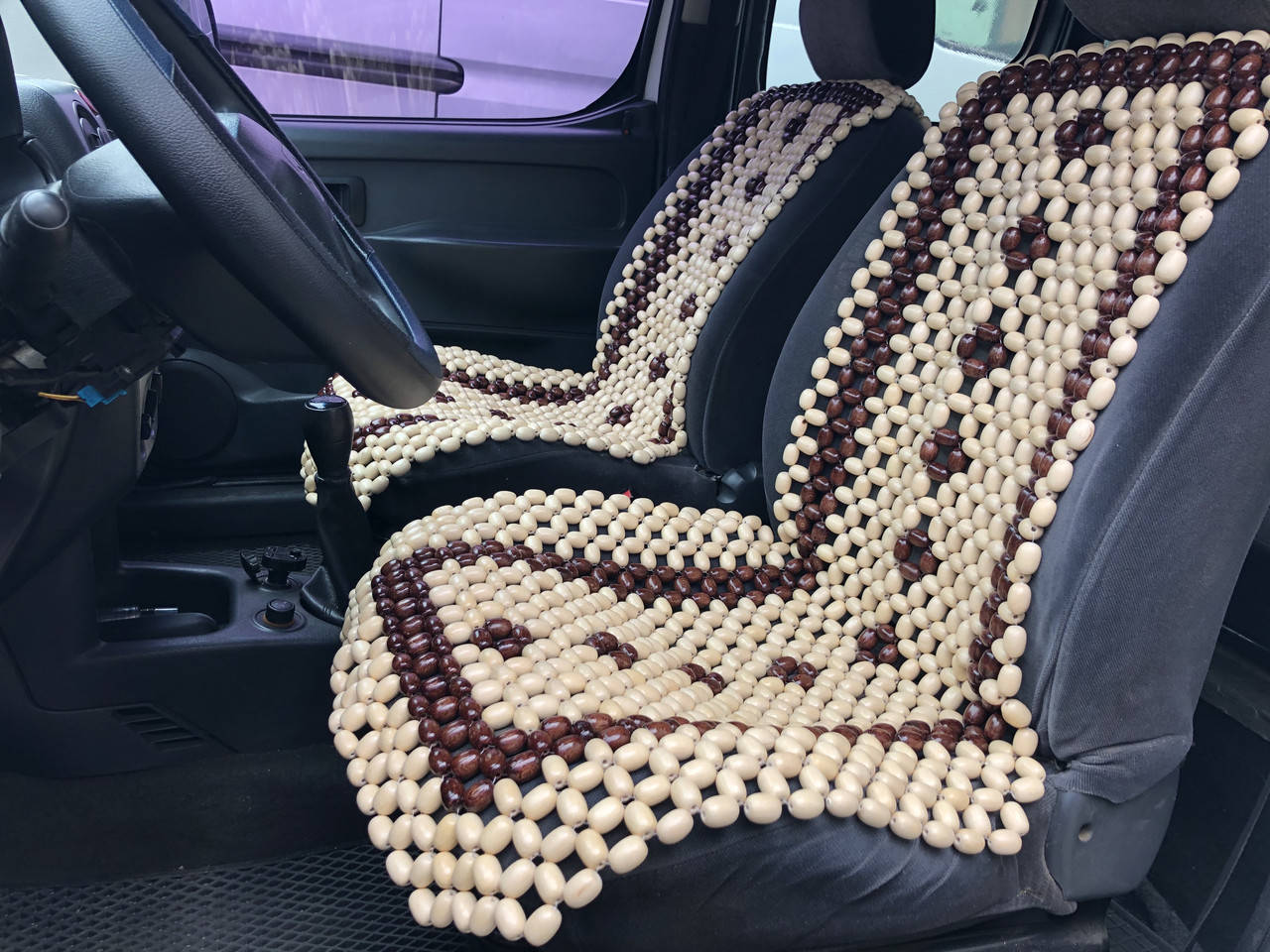 

Деревянная автомассажная накидка на сиденье автомобиля.