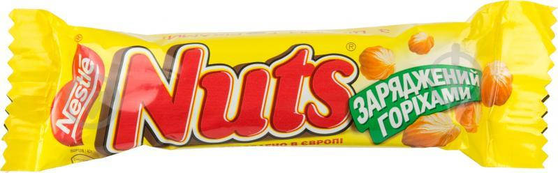 

Батончик Nuts с целыми орехами, покрытый молочным шоколадом 42 г.