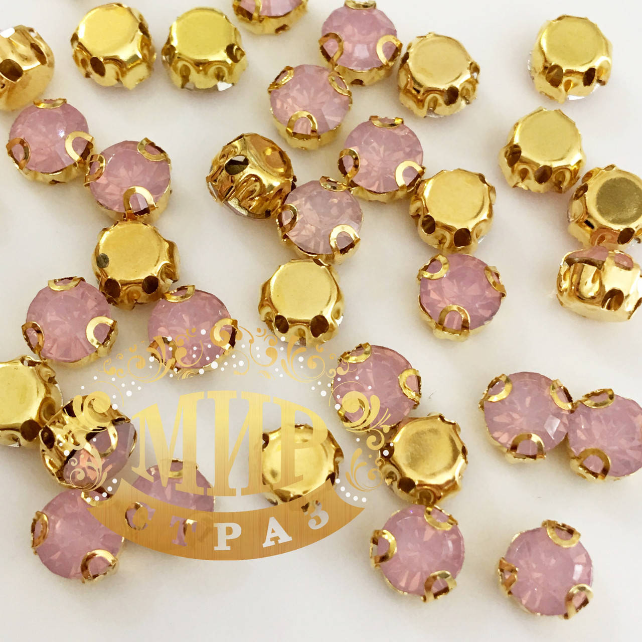 

Круглые стразы в золотых цапах Размер 5мм Цвет Pink Opal