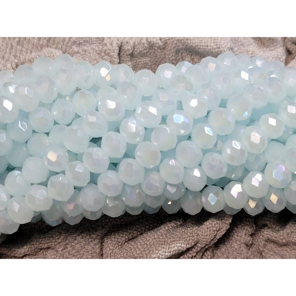 

Хрустальные бусины(рондель). Размер 4 мм. В упаковке прим.140 шт. цвет светло-голубой мат-прозрачный с ab