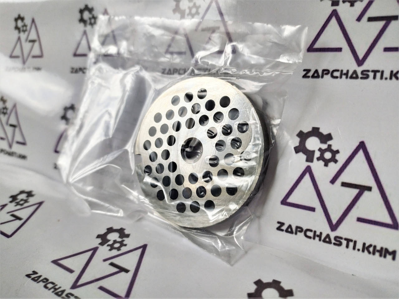 

Решетка (сито) средняя для мясорубки Zelmer, Bosch NR5. Оригинал. Отверстия 4 мм.