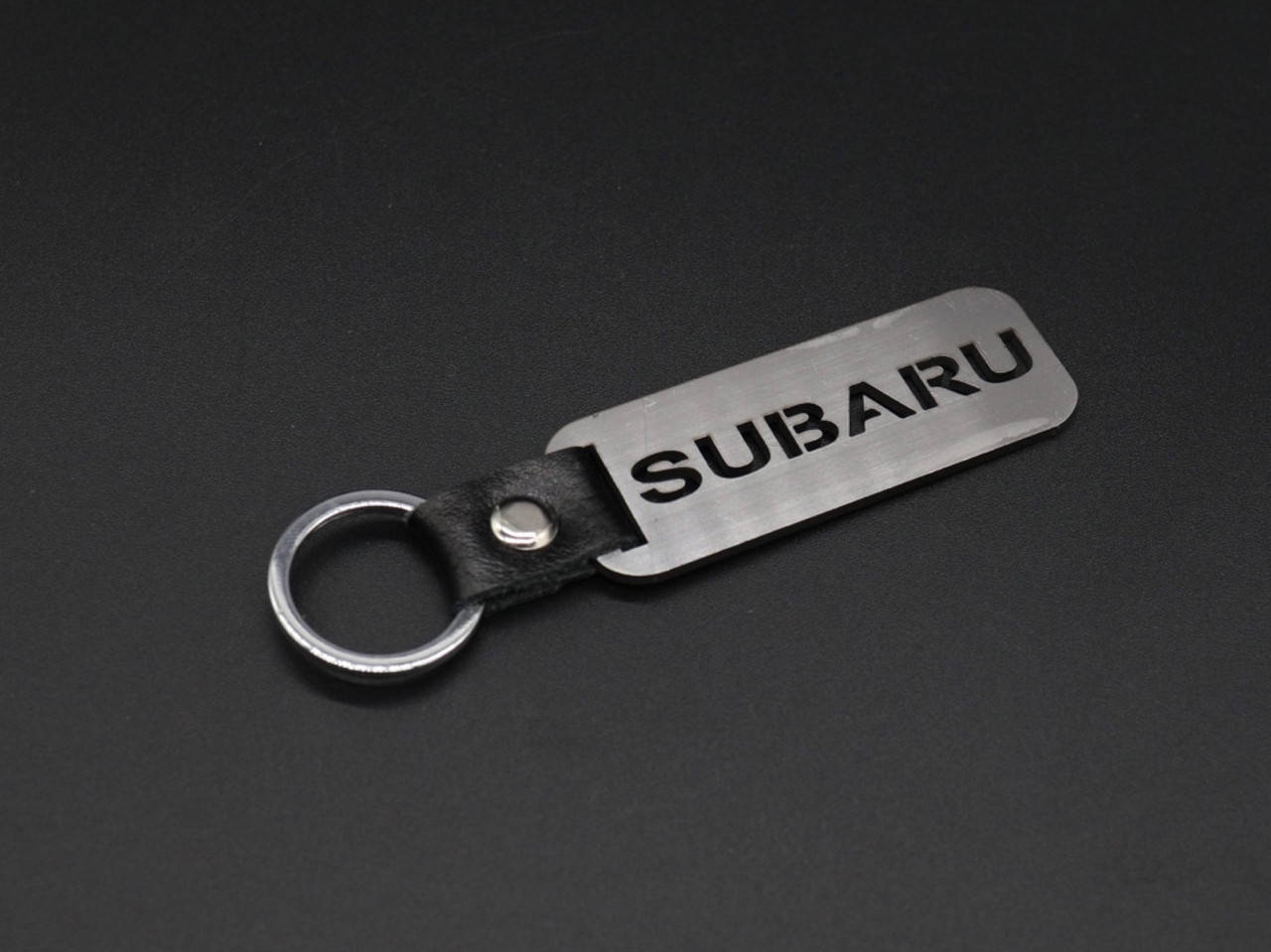 

Брелок металлический. Subaru. 10х2,5см, Коричневый