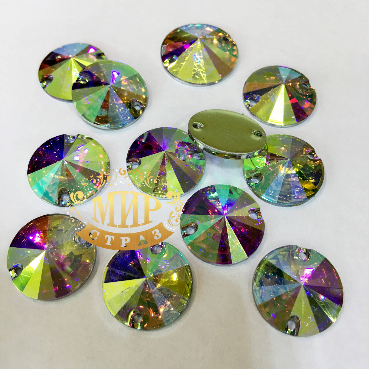 

Пришивные стразы(синтетич.стекло)Риволи 12мм.Цвет Crystal AB(хамелеон).Цена за 1шт