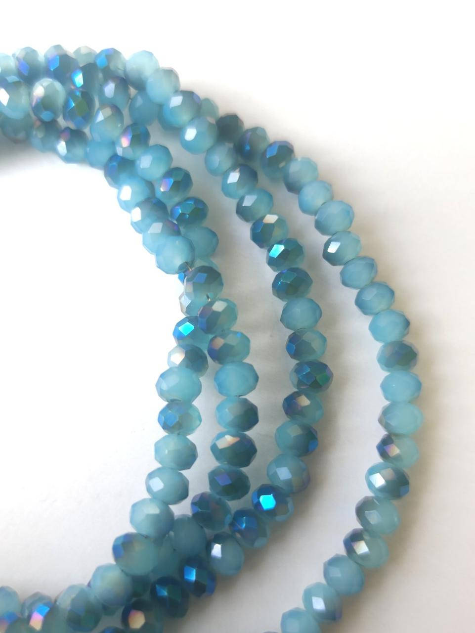 

Бусины хрустальные (Рондель) 4*3 мм пачка 135-140 шт, цвет - голубой матовый с синим переливом