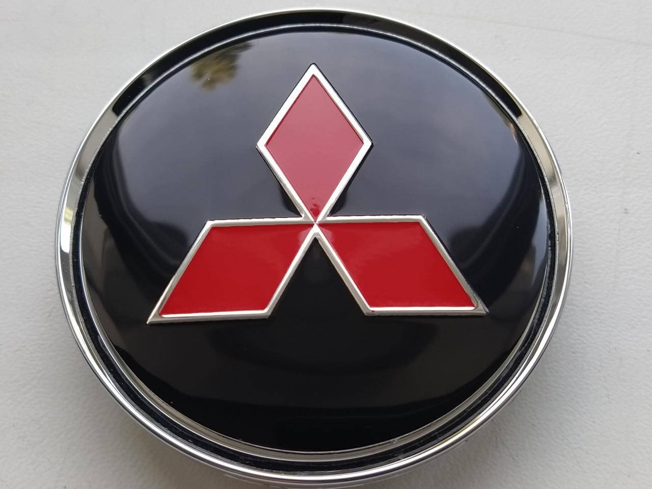 

Колпачки заглушки в литые диски Mitsubishi 63/58/8 мм. Черные, Хром.основа