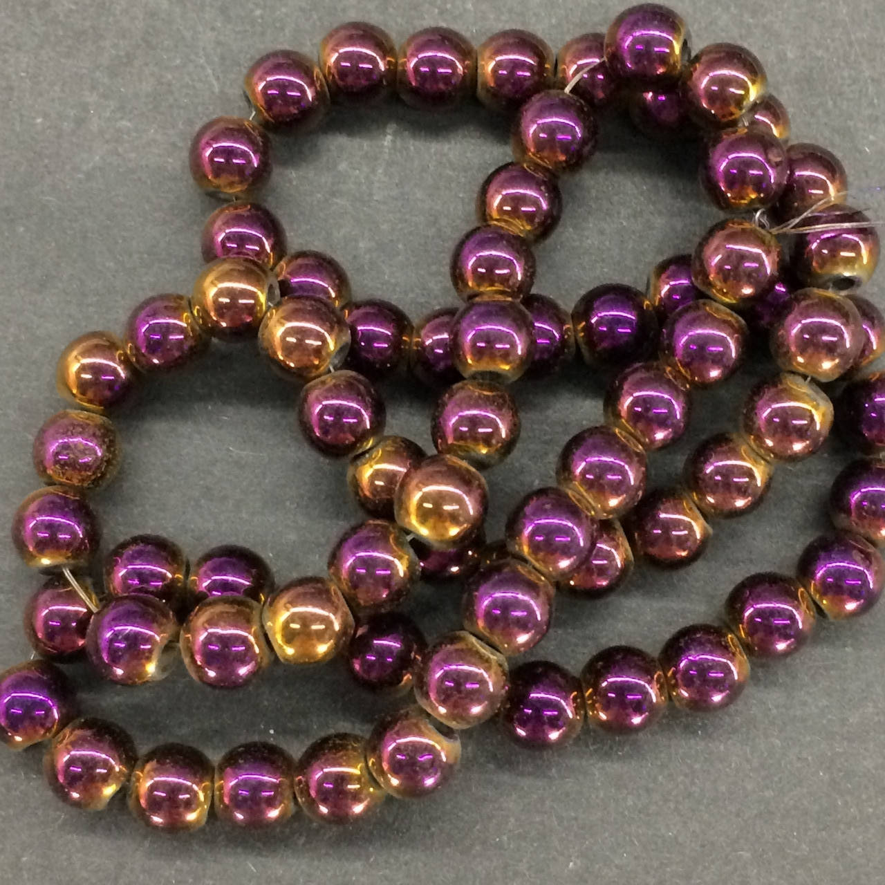 

Бусины на нитке Гематит сиреневый d=6 мм