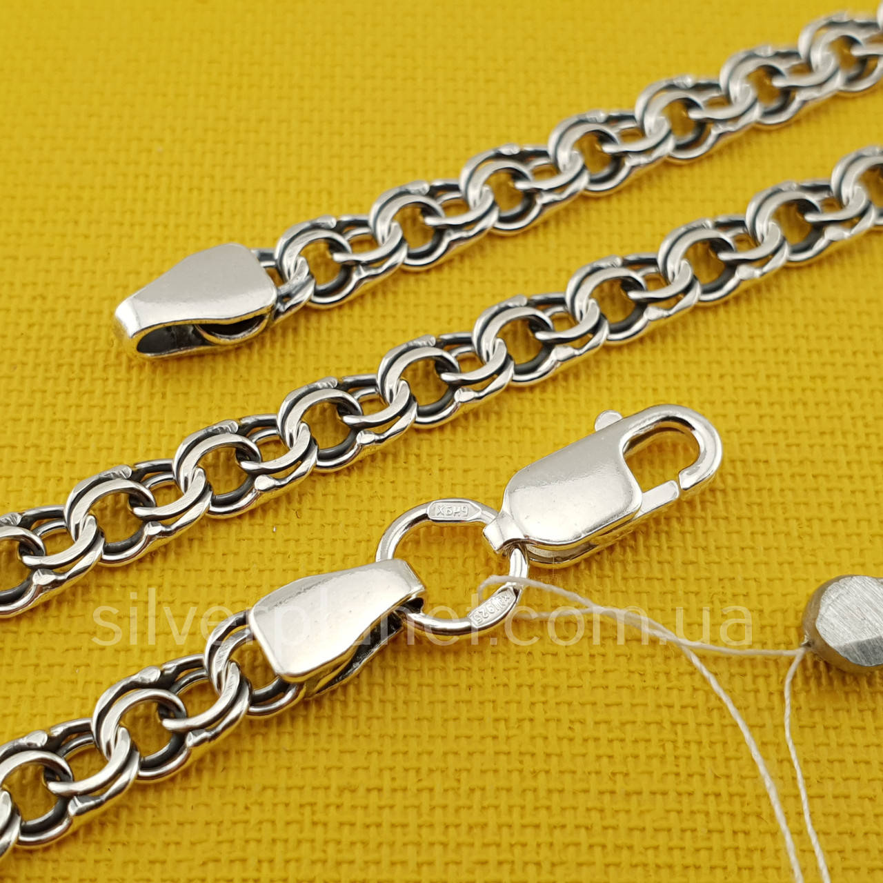 

Серебряная цепь бисмарк плоский. Ширина 4,5 мм. серебро 925. 65 см