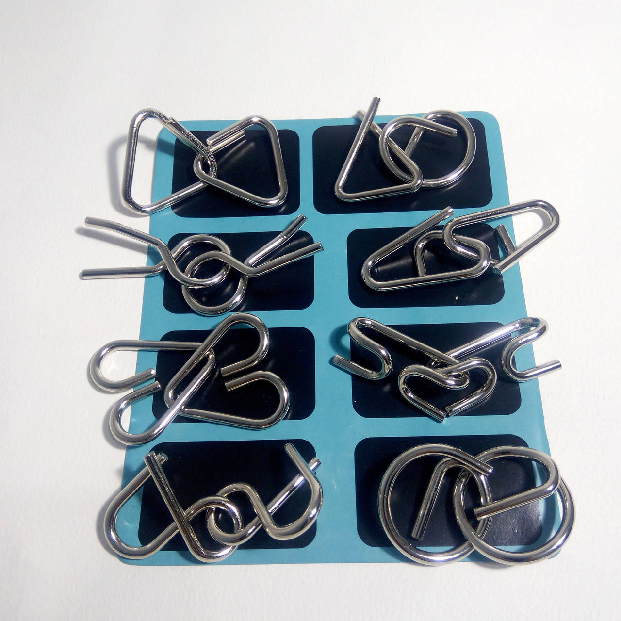 

Набор из 8-ми металлических проволочных головоломок Kaisiqi (бирюзовый набор)