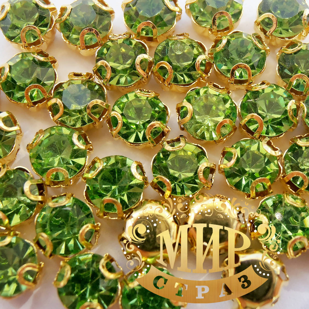 

Круглые стразы в золотых цапах, размер 5мм, цвет Peridot