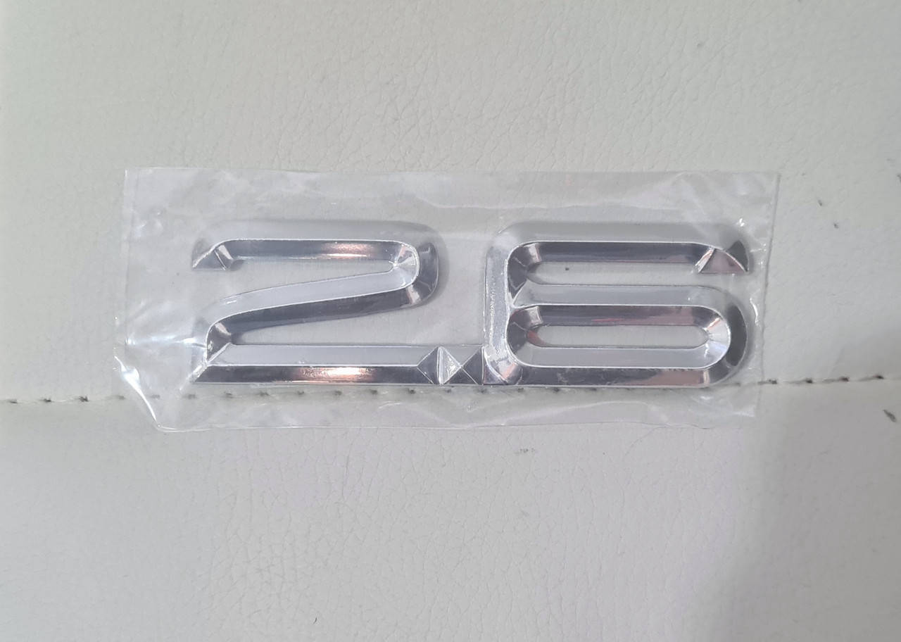 

Эмблема значок на багажник, надпись на багажник AUDI 2.6 (86x25)