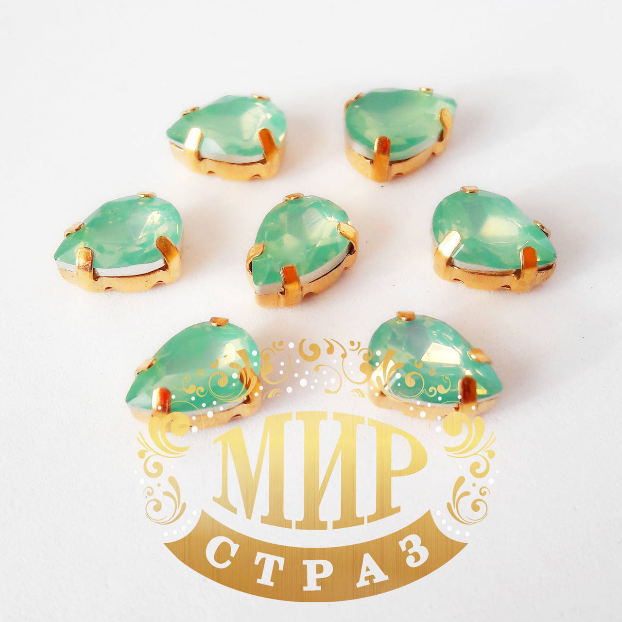 

Опаловые капли 7x10, в улучшенных золотых цапах, цвет Pacific Opal