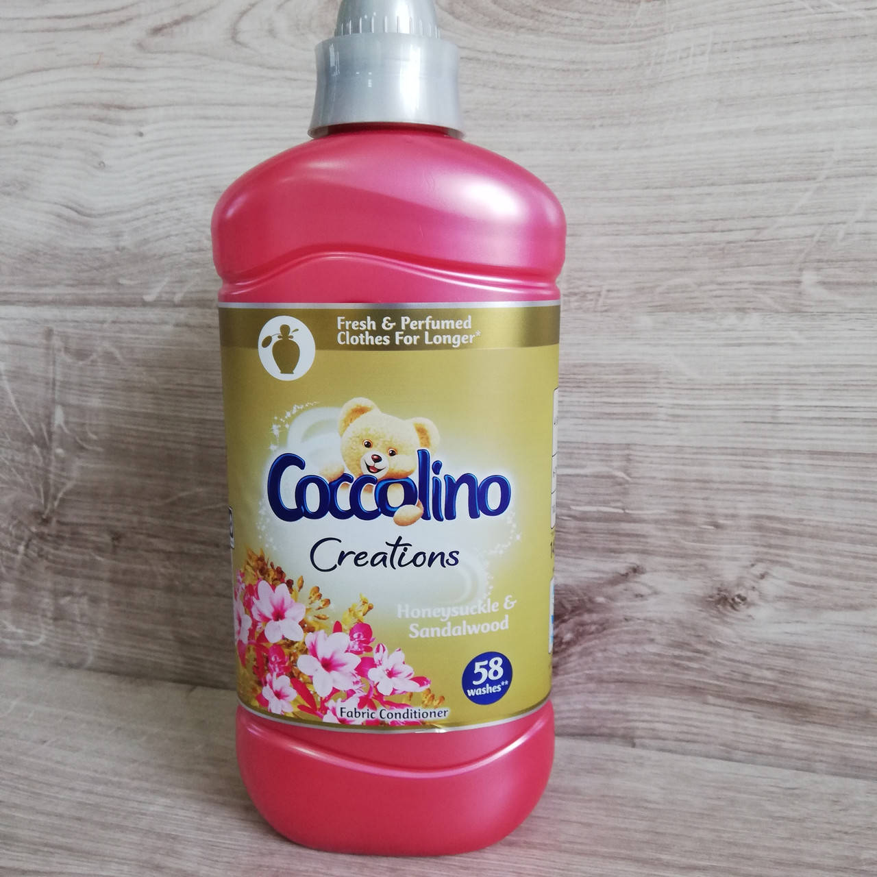 

Ополаскиватель Coccolino Honeysuckle & Sandalwood, 1,45 л (58 стирок)